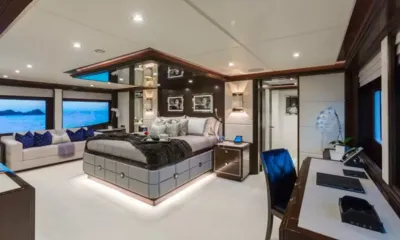 King Baby: Large owner's cabin with central bed, sofa under sea view windows and a desk