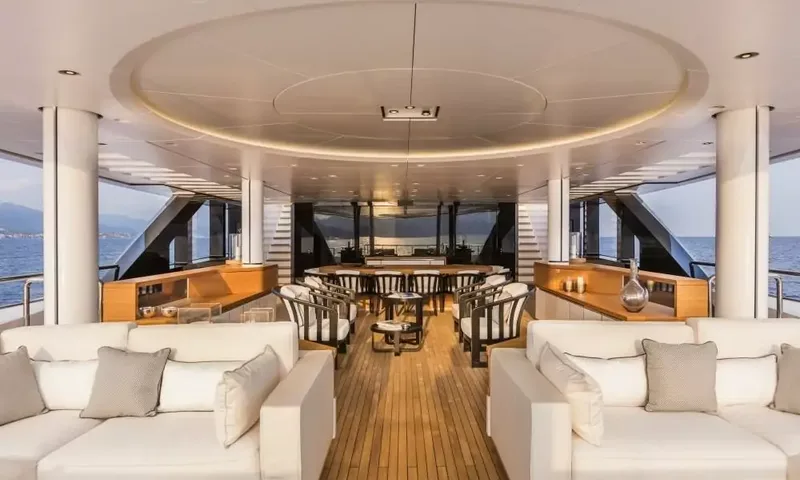 Suerte: Covered aft deck with white sofas, armchairs and a dining table beyond, sea views on both sides