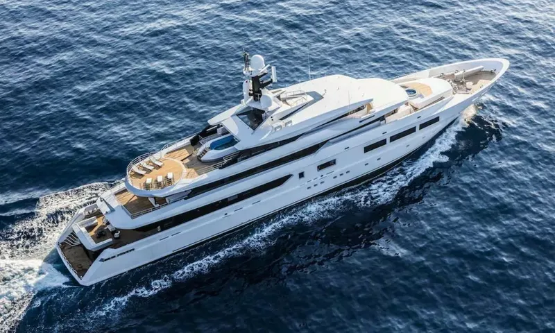 Suerte: Aerial view of the yacht under way showing sundeck loungers, pool and foredeck