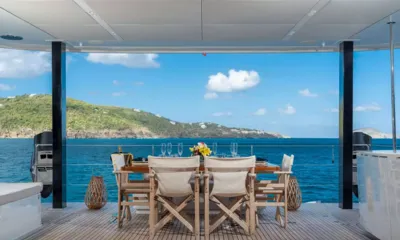 Bundalong: Covered aft deck dining table facing the sea and green hills