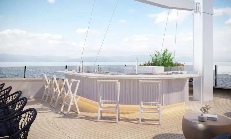 Scorpios: Deck bar with white folding stools, sink and planter overlooking calm sea