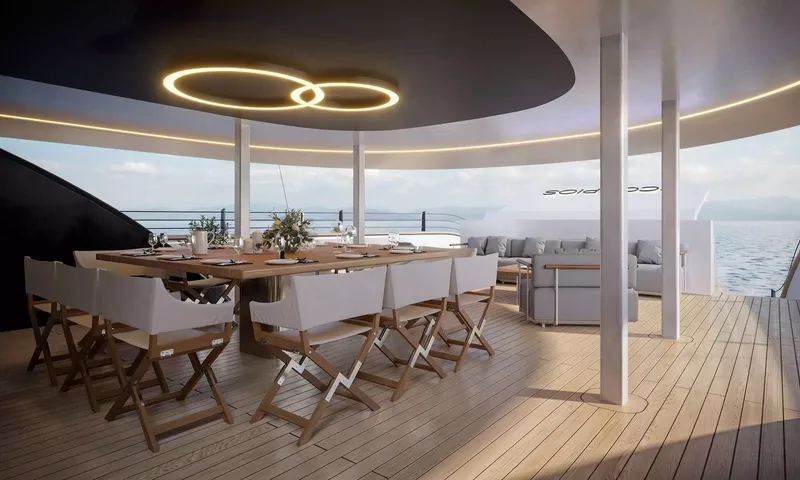 Scorpios: Covered aft deck dining table with director chairs, ring lights above and lounge sofas beyond