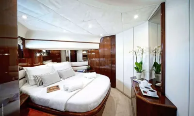 Distar Princess: Double cabin with large bed, wooden panelling, orchids and a tea tray