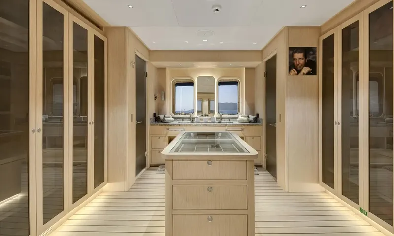 All About U 2: Dressing area with wardrobes, a central chest of drawers and twin sinks under windows