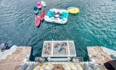 Valentina: Kayaks, paddleboards and inflatables floating behind the stern, snorkel gear on the platform