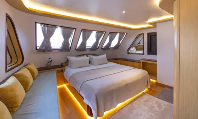 Vision: Cabin with double bed, under bed lighting, curtained windows and a sofa