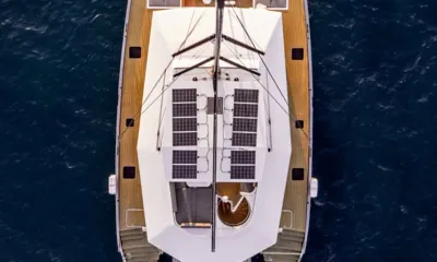 Hani I: Overhead view of catamaran with teak decks, solar panels and spiral staircase