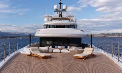 Lady A: Teak foredeck with two sun loungers and a lounge facing the sea, superstructure and radar mast above