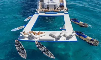 HH Noverra: Plataforma de piscina marinha flutuante na popa com espreguiçadeiras, caiaques, pranchas de stand up paddle e motos aquáticas