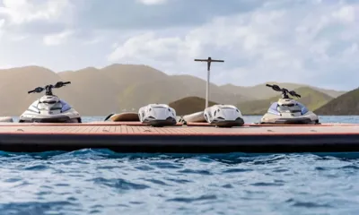 Ad Astra: Two jet skis, two underwater scooters and a hydrofoil board on a floating dock
