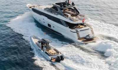 Danlou: Yacht cruising with a tender close by and a jet ski on the stern platform