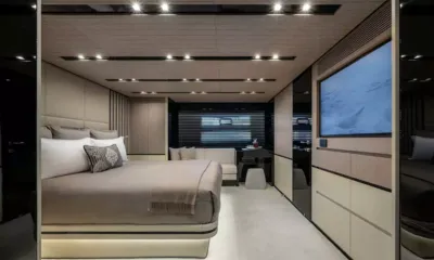 Spare Wheels: Cabin with double bed, wall television, desk and sofa under window blinds