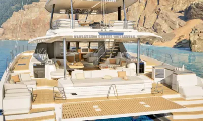 Nargiza: Stern view of catamaran showing swim platform, aft lounge, dining area and flybridge