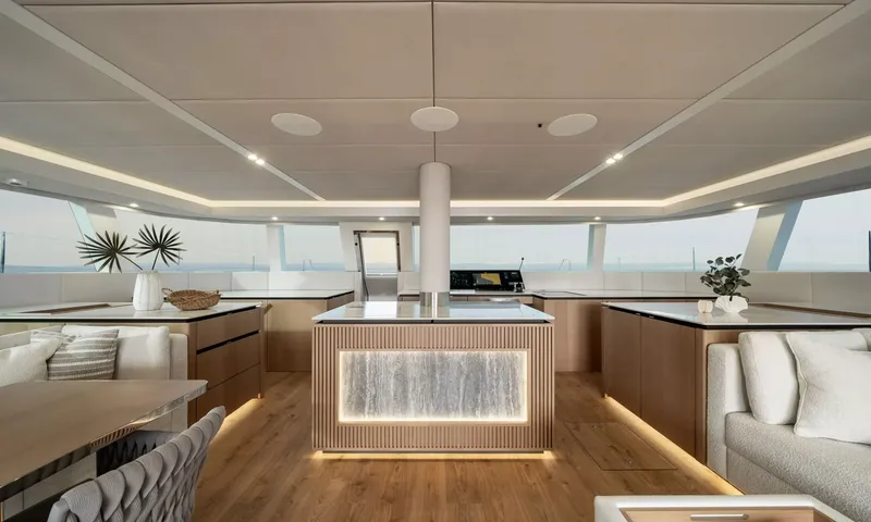 Ankawer VI: Forward saloon with backlit stone island, wood counters and panoramic windows