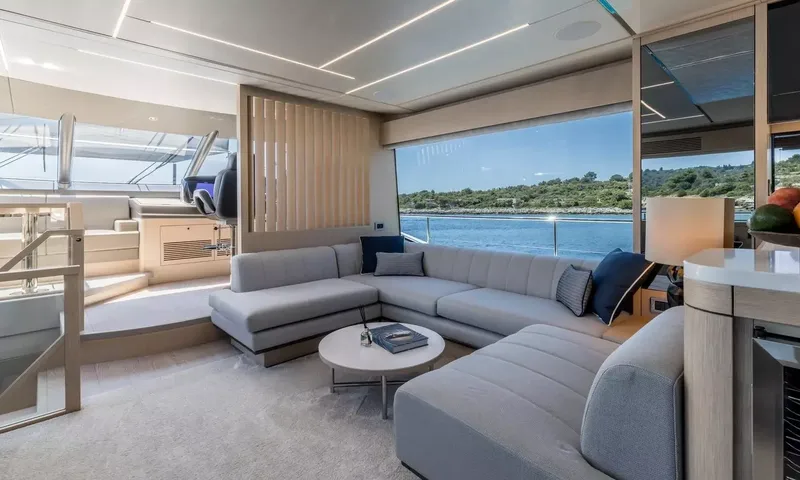 Ascend: U shaped sofa with round coffee table and sea view window