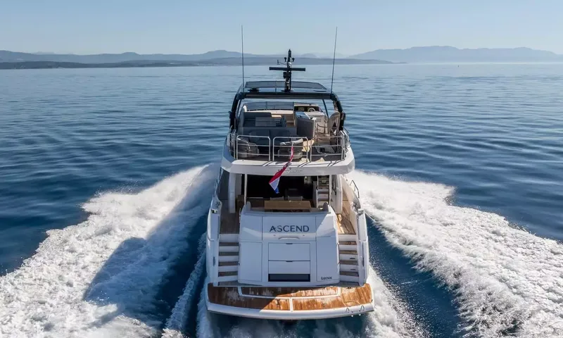 Ascend: Stern view of the yacht under way leaving a white wake