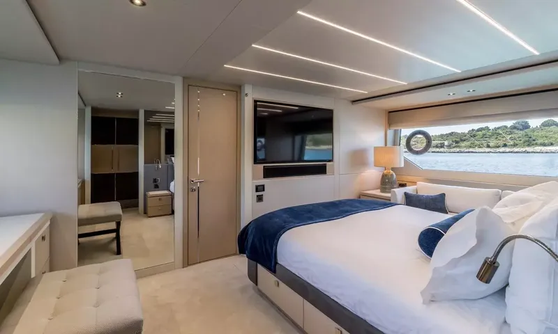 Ascend: Main cabin with double bed, wall television, sofa by the window and dressing area