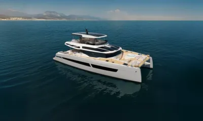 Elly II: Elevated view of a white catamaran showing foredeck lounge with jacuzzi and flybridge