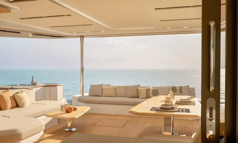Elly II: View from the saloon door onto the aft deck lounge and table facing the sea