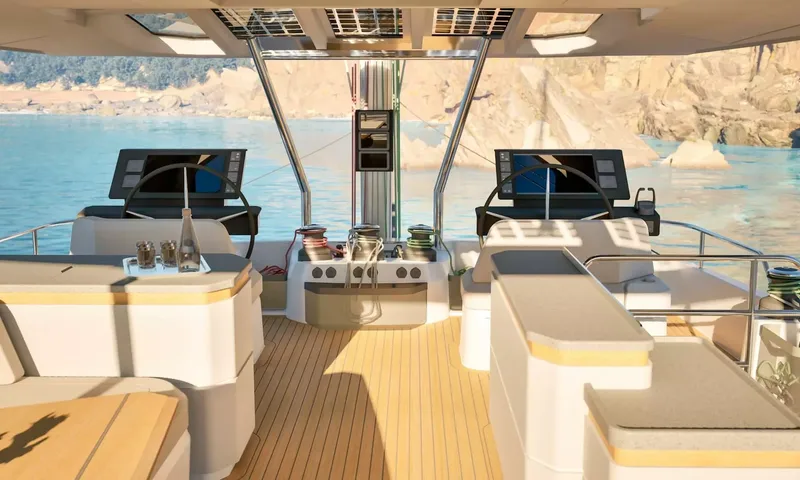 Elly II: Flybridge with twin helm stations, wheels, screens and winches
