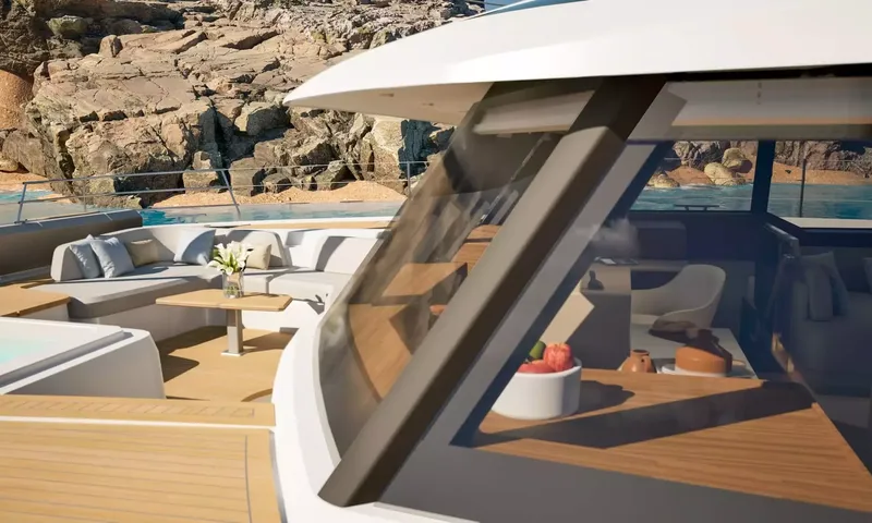 Elly II: Foredeck lounge seen past the saloon windscreen, rocks behind