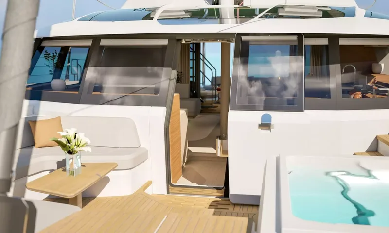 Elly II: Foredeck seating and jacuzzi beside the forward door into the saloon