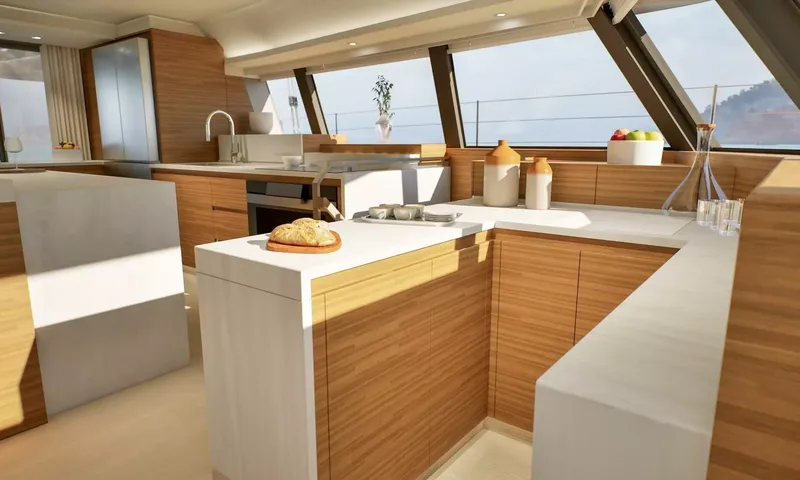 Elly II: Galley counters in white and wood with bread and jugs, sea view windows