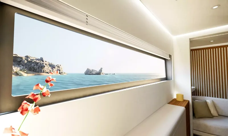Elly II: Long hull window framing sea and rocks, red flowers in foreground