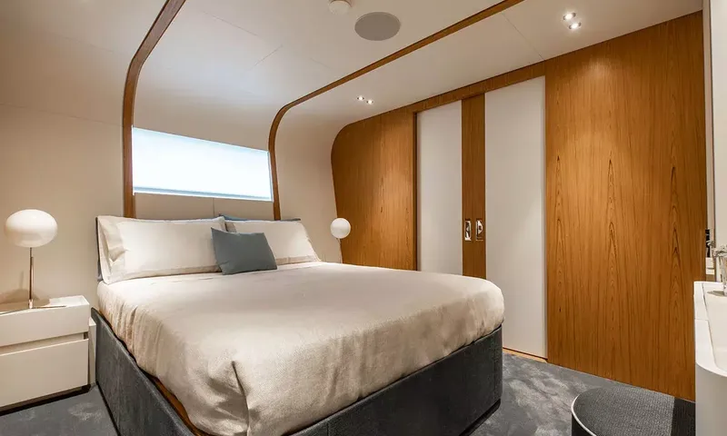 Angel: Double cabin with grey base bed, bedside lamps and wood panelled wardrobes