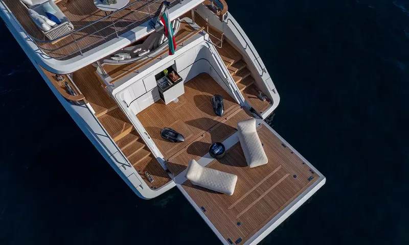 Angel: Overhead view of the stern platform with two loungers and underwater scooters