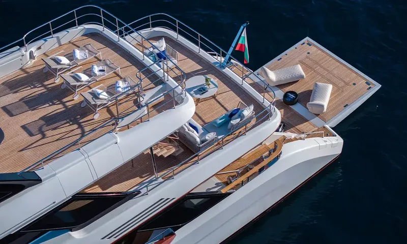 Angel: Aerial view of aft decks with sun loungers, lounge seating and extended swim platform