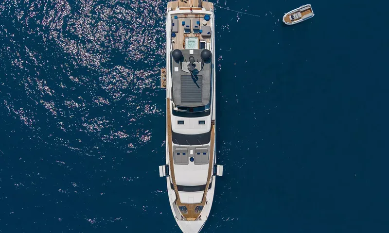 Kristo: Overhead view of the yacht at anchor with a deck jacuzzi and a tender nearby