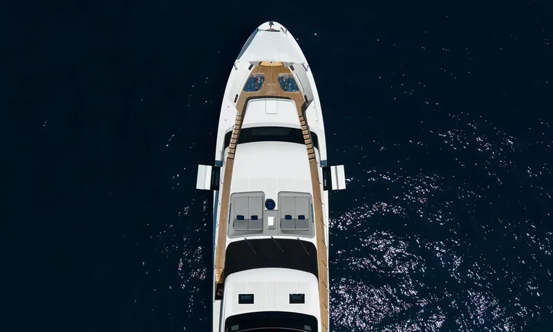 Kristo: Overhead view of the bow and foredeck sunpads on deep blue water