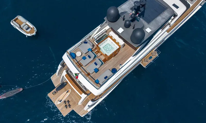 Kristo: Aerial view of the upper deck with jacuzzi, lounge seating, swim platform and tender alongside