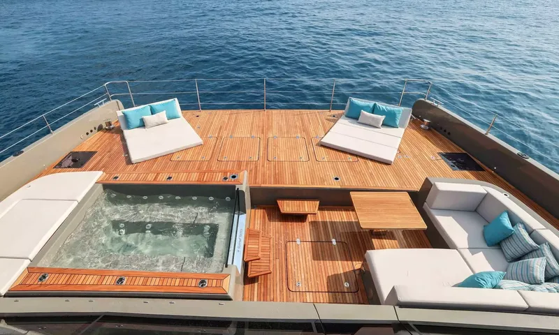 Amitatu: Teak foredeck with jacuzzi, two sunbeds and a lounge sofa overlooking the sea