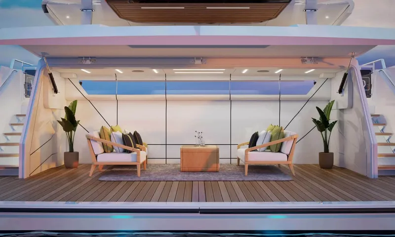 Yoto: Beach club lounge at the stern with two armchairs, a wooden table, plants and side stairs