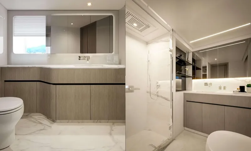 Yoto: Two views of a bathroom with marble floor, vanity, toilet and glass shower