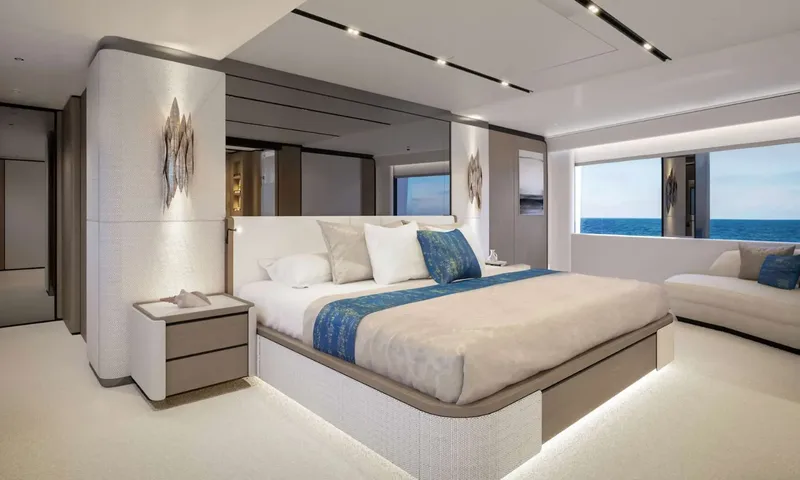 Yoto: Spacious cabin with double bed, blue runner, sofa and wide sea view window