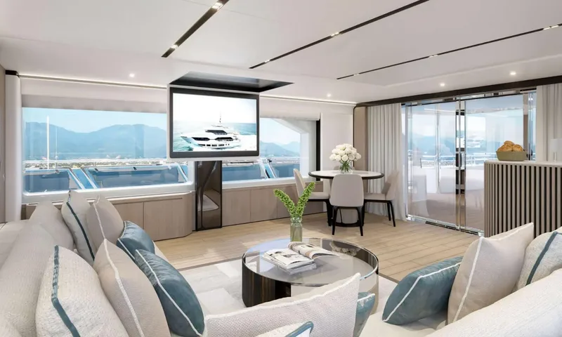 Yoto: Lounge with cushioned sofas facing a ceiling mounted television and sea view windows