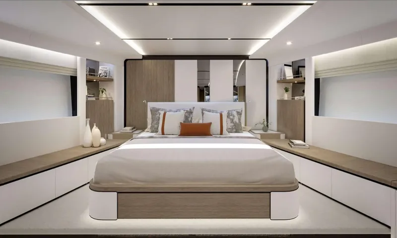 Yoto: Symmetrical cabin with central double bed, orange cushion and storage benches
