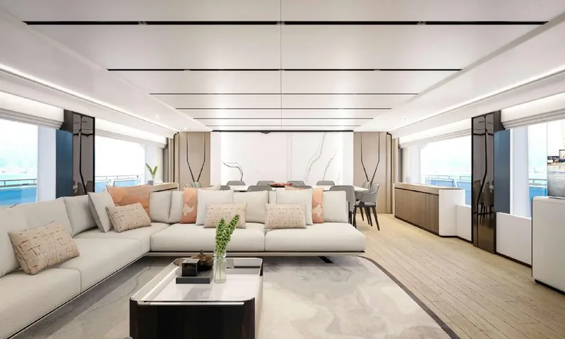 Yoto: Bright main saloon with large corner sofa, coffee table and dining area beyond