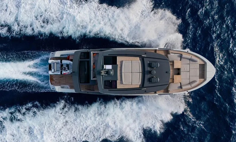 Jamon: Overhead view of the yacht under way with wide white wake