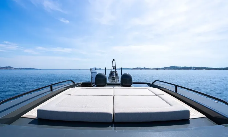CC: Large sunpad on the roof deck with radar domes and open sea views