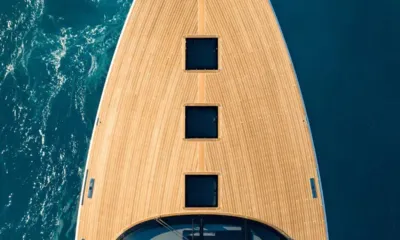 Dutch Pearl: Overhead view of the teak foredeck with three square hatches above dark water