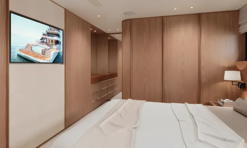 Aitana: Cabin seen from the bed with wall screen, wooden wardrobes and drawers