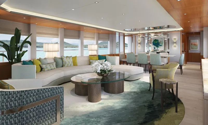 Lumière: Bright saloon with curved white sofa, glass coffee table and dining area beside large windows