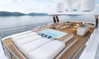 Lumière: Top deck with large white sunpads, a jacuzzi, bar and lounge seating overlooking hills and sea