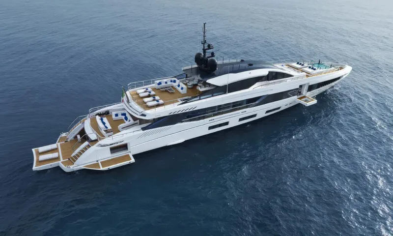 Betsy: Overhead view of white yacht at sea showing open stern decks, loungers and a bow pool