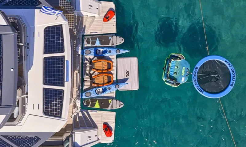 Alina: Overhead view of stern with paddleboards, kayaks, floating mat, towable tube and water trampoline