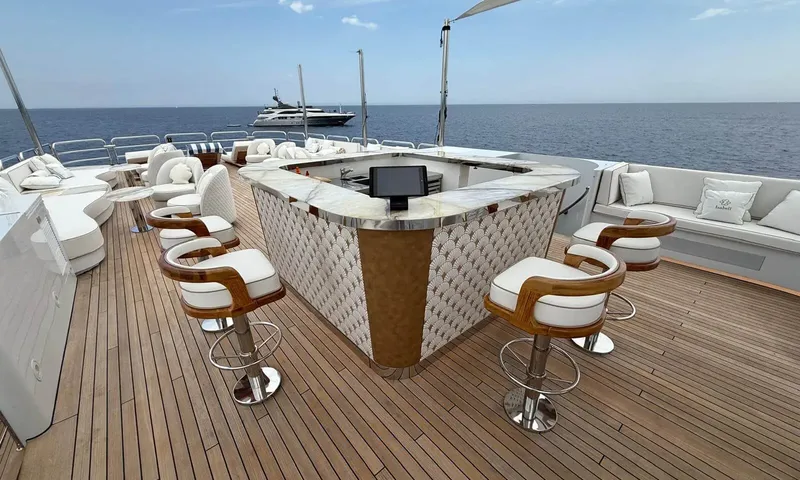 Isabell Princess of the Sea: Top deck bar with stools, white lounge seating and open sea view
